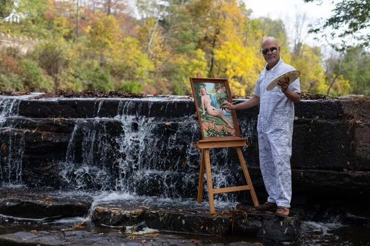 Trey Speegle painting en plein air by a waterfall